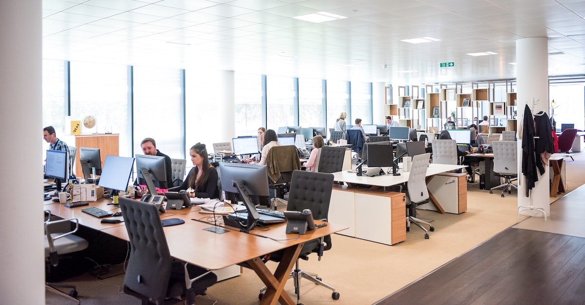 Bright LED lights shine over a full corporate office.