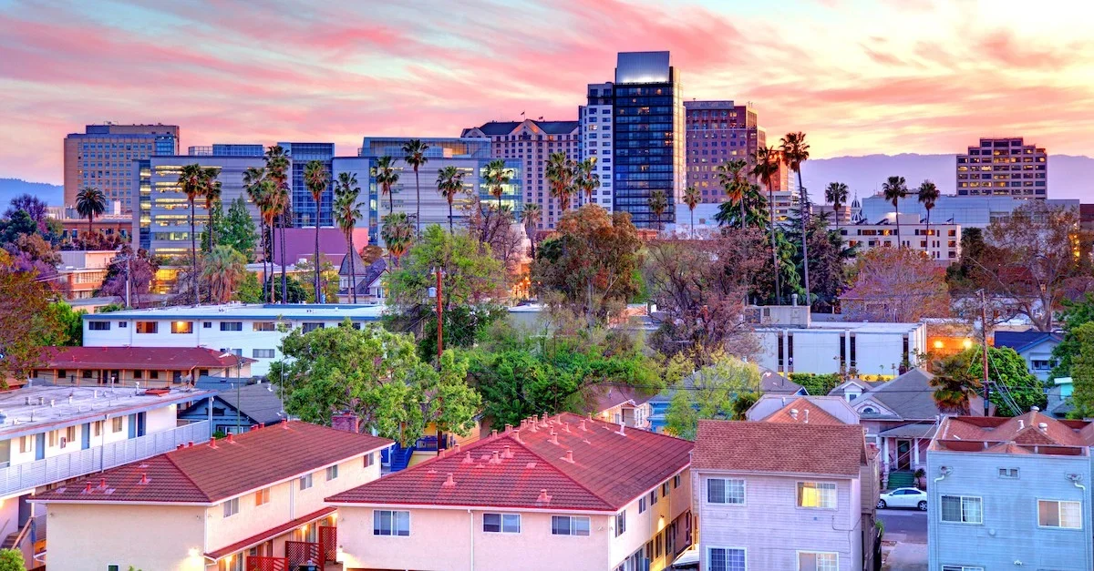 San Jose's downtown business district during a pink-colored sunset