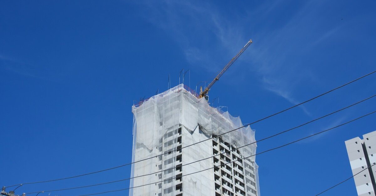 A crane on top of a development property