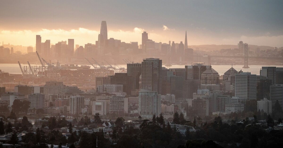 A city with a downtown port is covered in smoke and smog