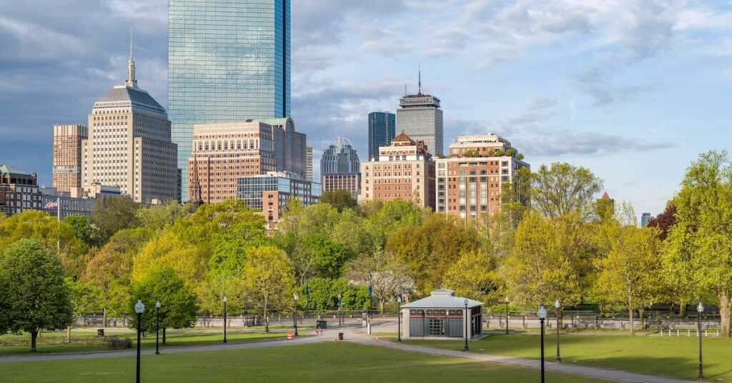 A view of downtown Boston's commercial real estate market from a nearby park