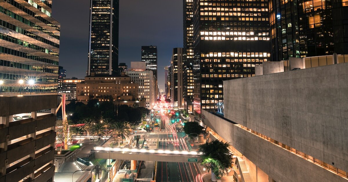 a busy downtown road with walking overpasses in New York City