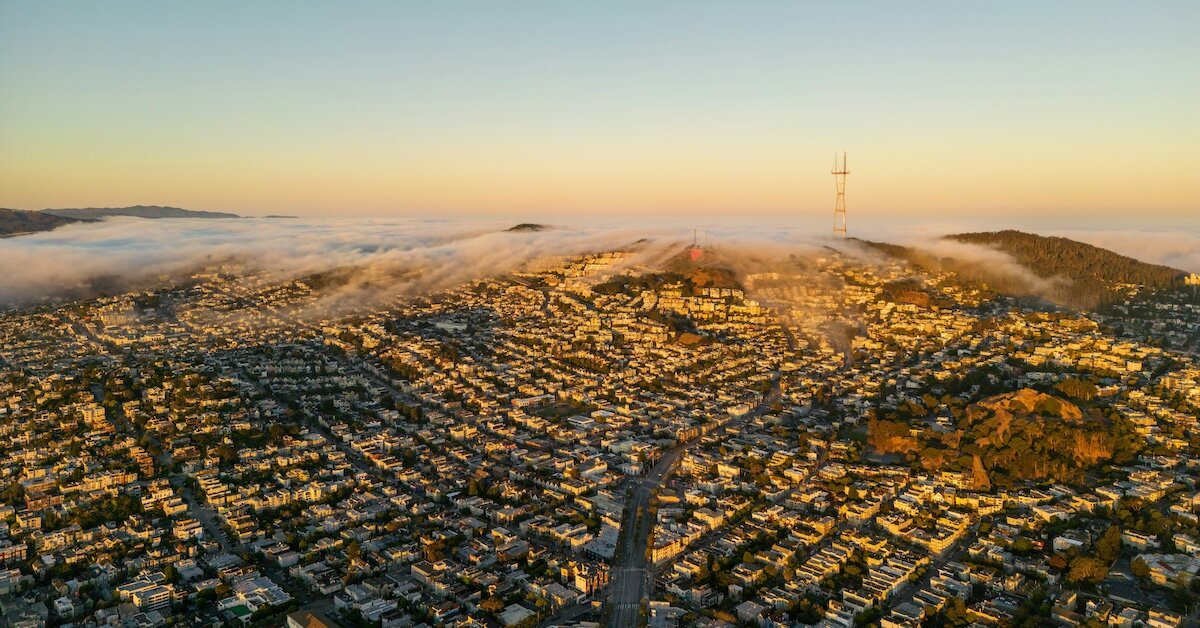 Fog rolls into the city of San Francisco at sunrise