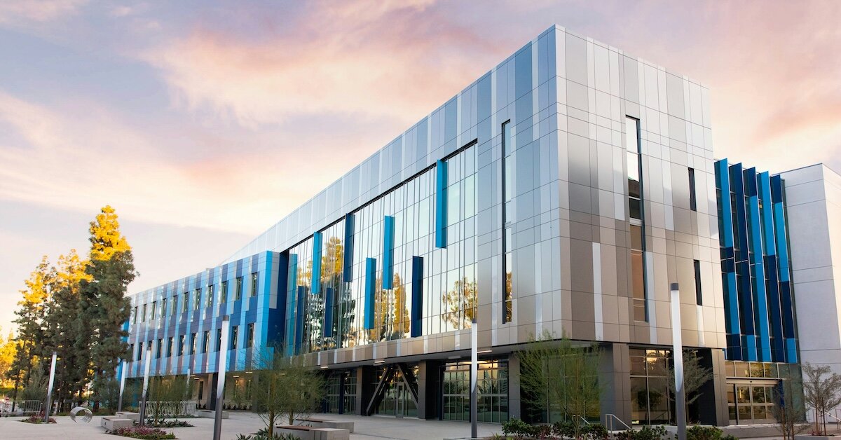 A shiny silver commercial real estate building and office
