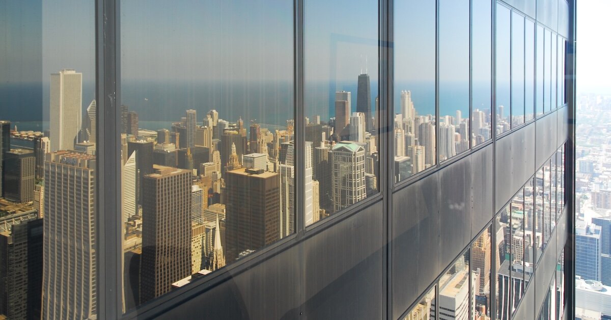 A reflection of Manhattan's city skyline in a commercial office building, showing the dozens of skyscrapers in the city