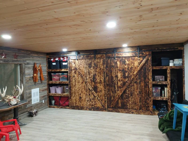 Custom stained wood sliding barn doors with open storage shelves