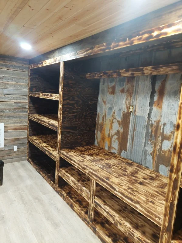 Dark stained wood entertainment unit with open shelves