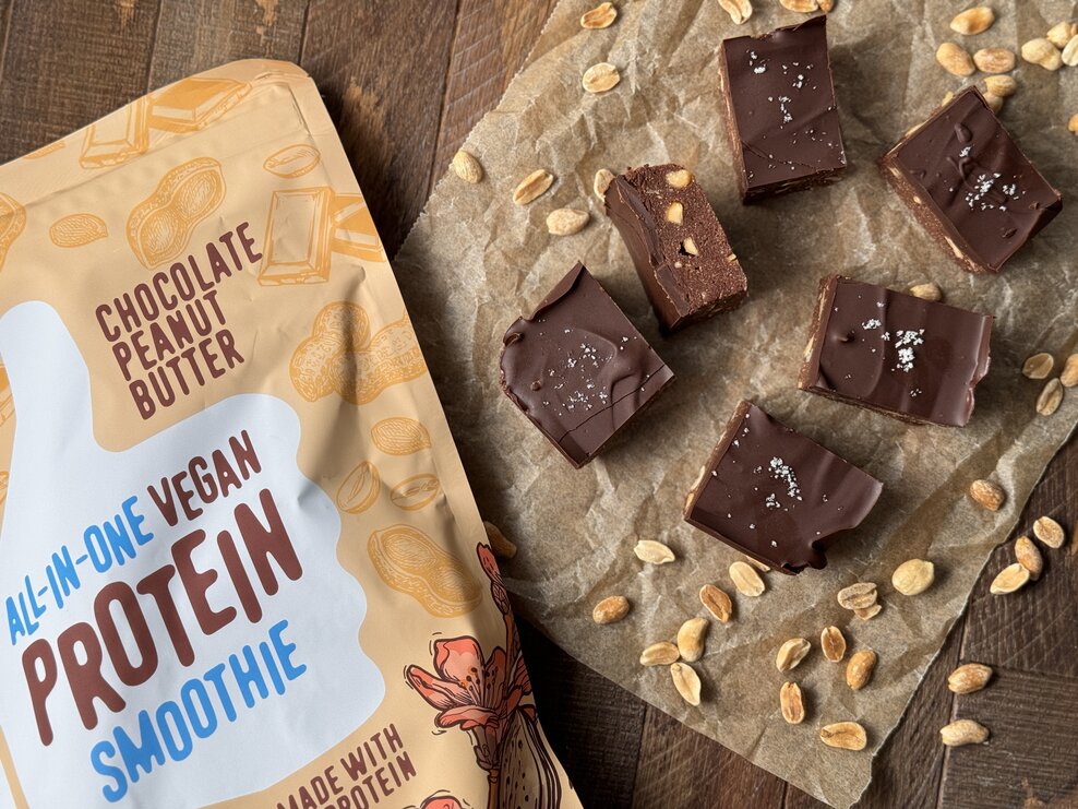 a bag of vegan chocolate peanut butter protein and 6 squares of peanut crunch bars