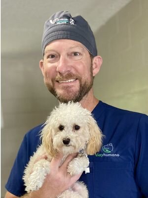 Dr. Christian D. Broadhurst holding Sprig after his full recovery, Clay Humane Animal Clinic, Orange Park, FL