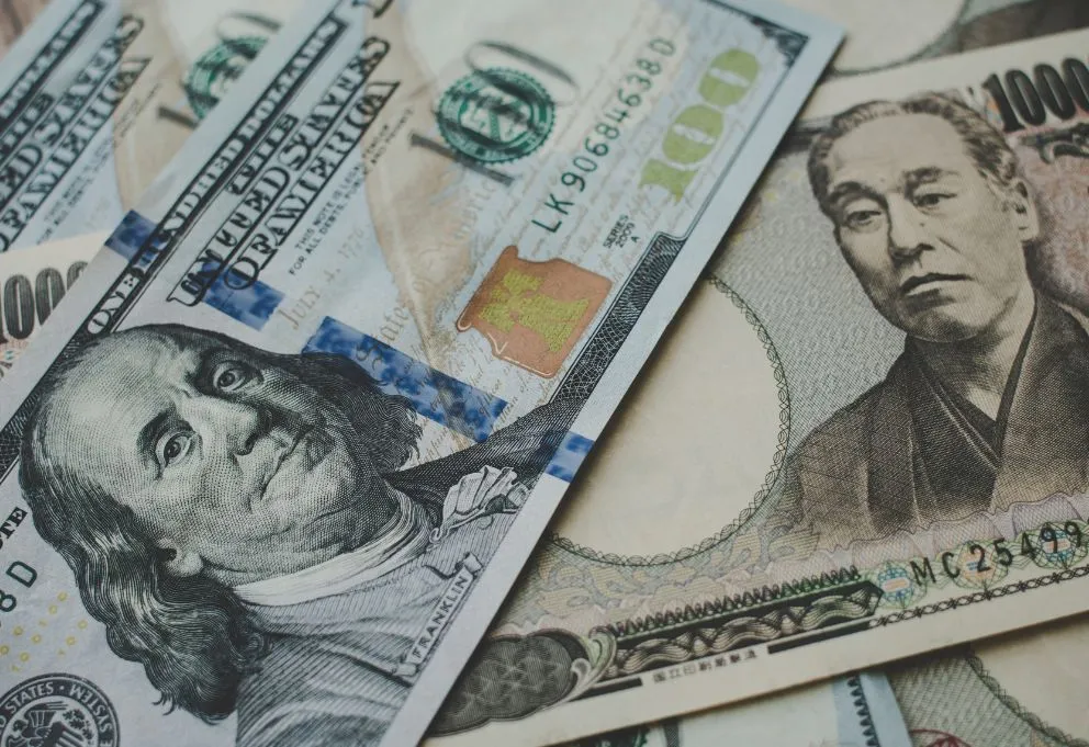 Pile of US dollar and Japanese yen