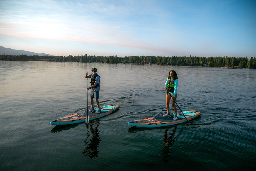 Woman doing yoga on paddle board 