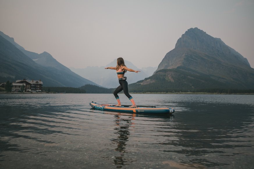 Woman doing yoga on paddle board 