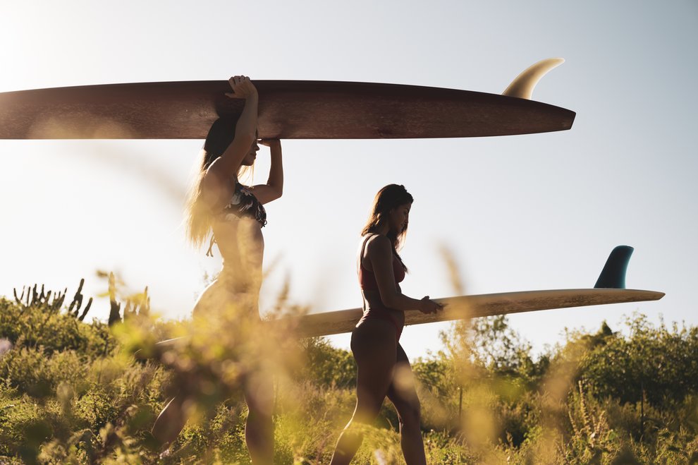 Two girls with surf boards