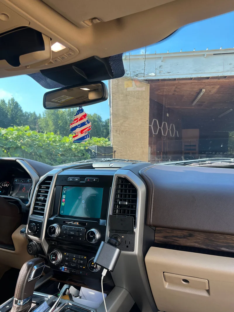 Dark pickup truck with reflective ceramic window tint