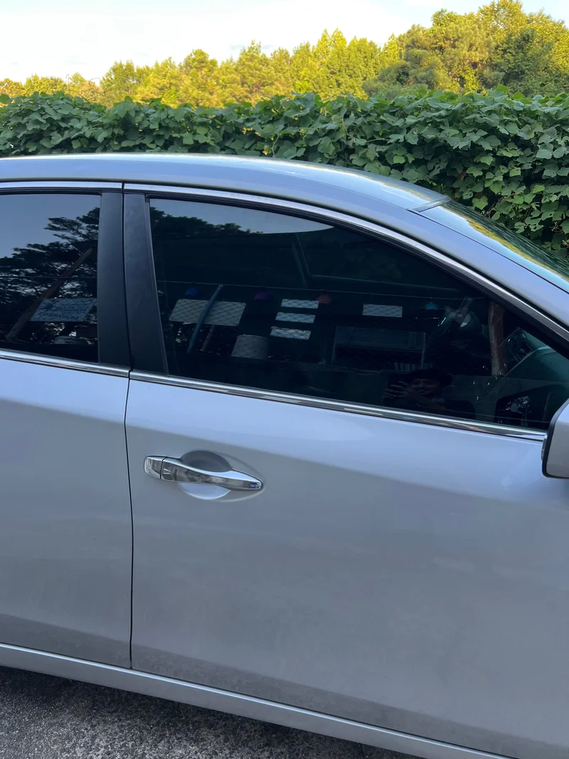 Silver vehicle side window with fresh tint