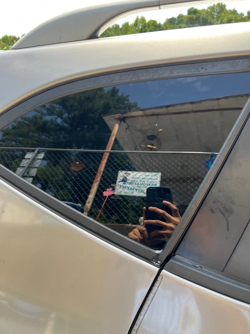 Silver vehicle with newly tinted side glass