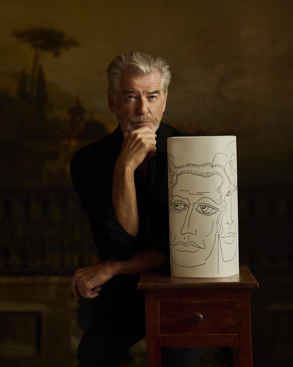 Pierce Brosnan with Vase and drawings from So Many Dreams