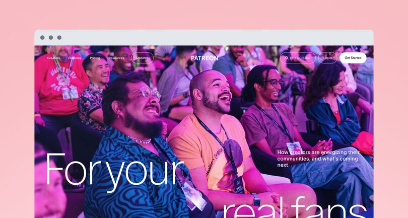 Patreon homepage featuring a vibrant photo of diverse community members at an event, smiling and engaged. Text overlay reads 'For your real fans' with navigation menu at top.