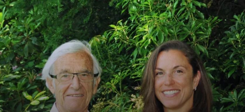 Two people stand side by side