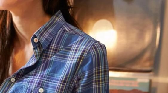 A woman looks past her computer