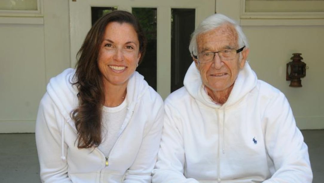 Two people sit side by side