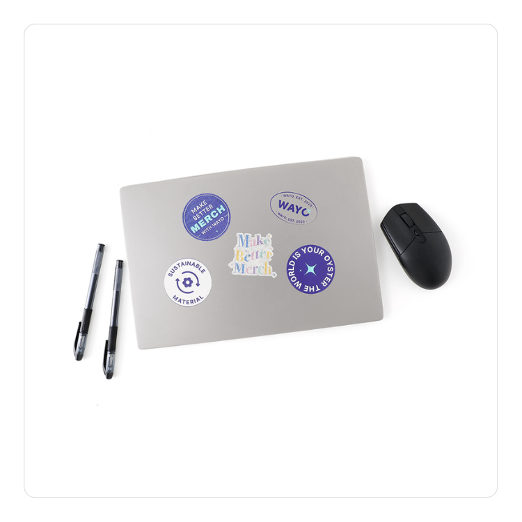 Photo of stickers designed by Wayo on top of a laptop