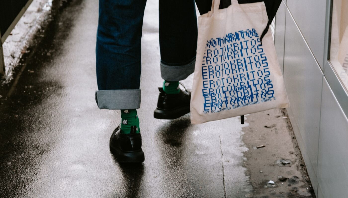 Person walking with a tote bag