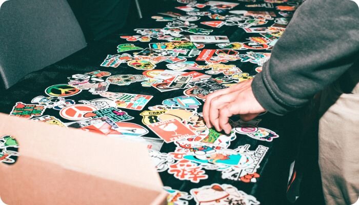 Person looking through stickers on a swag table