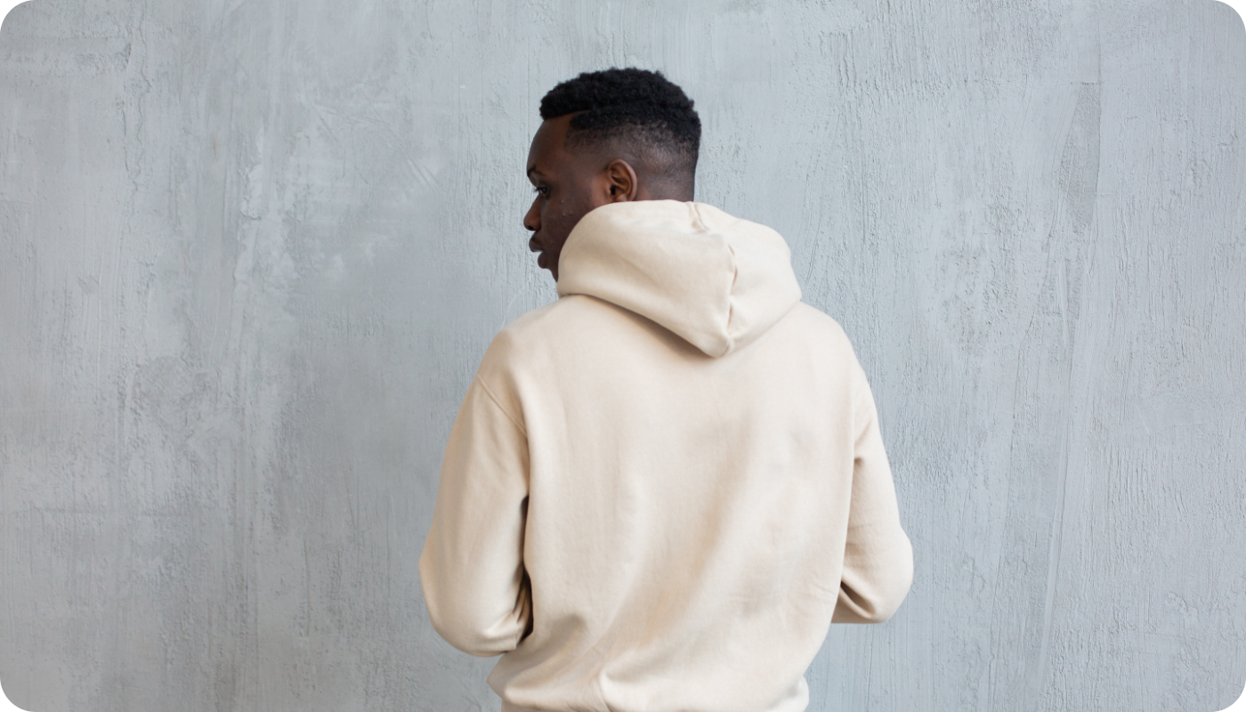 Young man wearing a white hoodie sweater