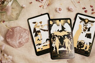 Three tarot cards, knight of cups, the lovers, two of cups