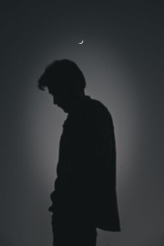 a man standing in silhoutte