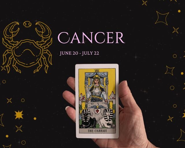 three tarot cards on a table and a hand holding gems