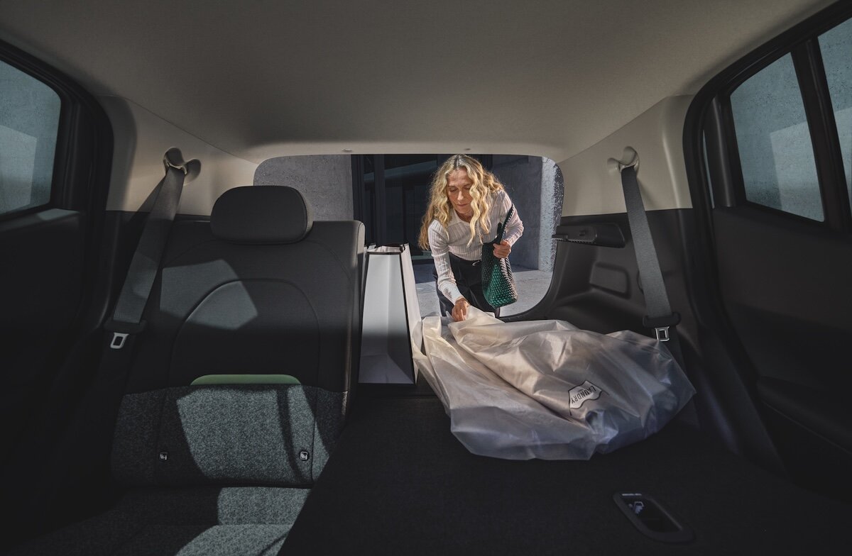 2026 Kia EV2 showing a person loading the 403-litre boot