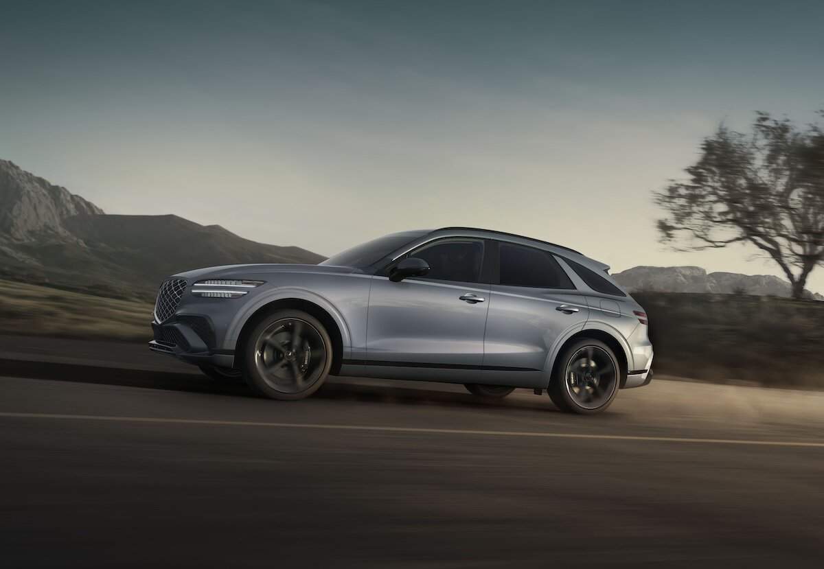 2027 Genesis GV70 side view, driving