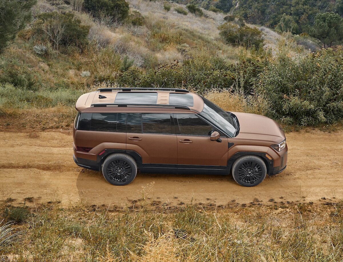 2027 Hyundai Santa Fe static side view parked on gravel