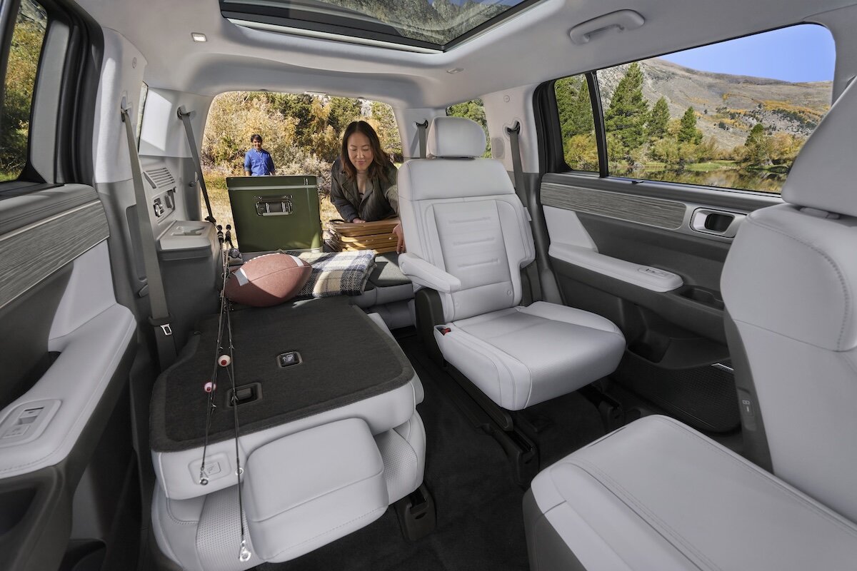 A car guru, happy to have purchased a car.