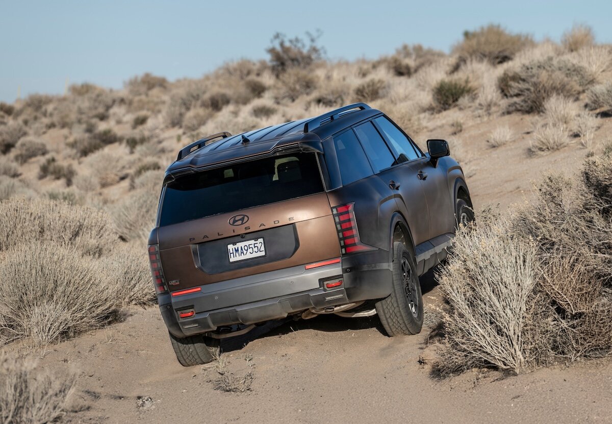 2026 Hyundai PALISADE XRT PRO driving in sand, rear view