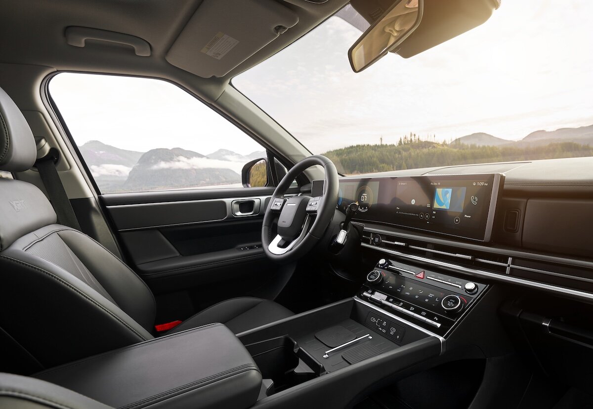 A car guru, happy to have purchased a car.