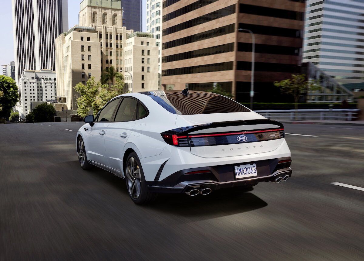 2025 Hyundai SONATA rear driving through the city, white bodywork