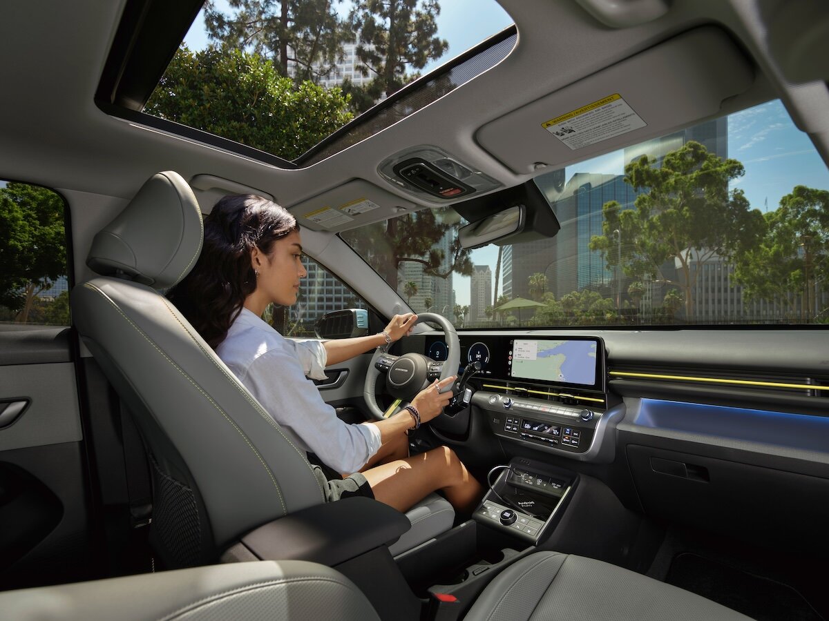 A car guru, happy to have purchased a car.