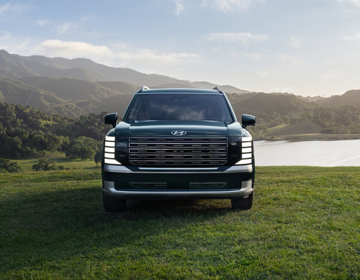 2026 Hyundai Palisade parked on grass, front view, headlights on