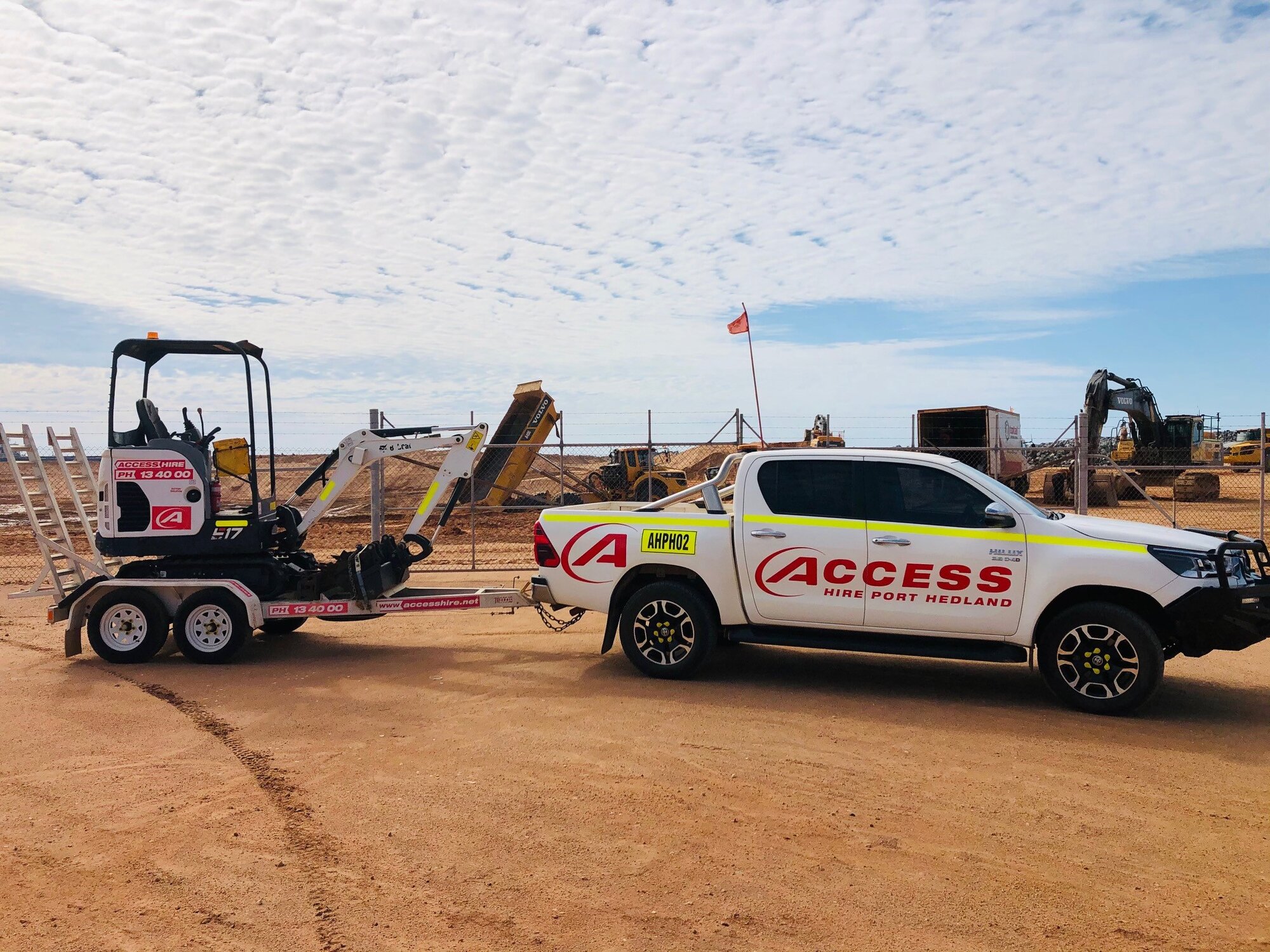 Access Hire service vehicle transporting a compact excavator to a project site in Port Hedland, Western Australia