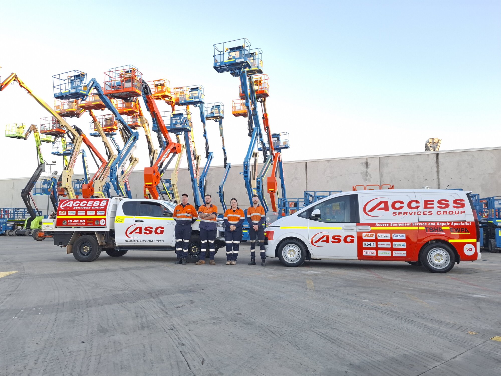 Access Service Group technicians with service vehicles in front of access equipment fleet at Canning Vale, Western Australia.