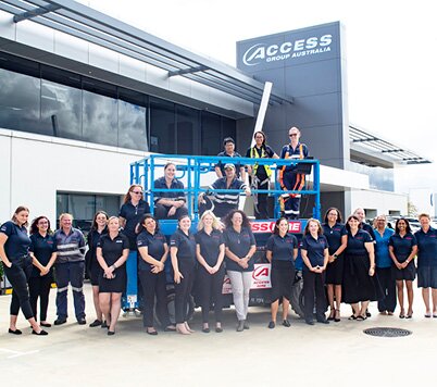 Access Hire Perth team members gathered outside the Perth head office with access equipment