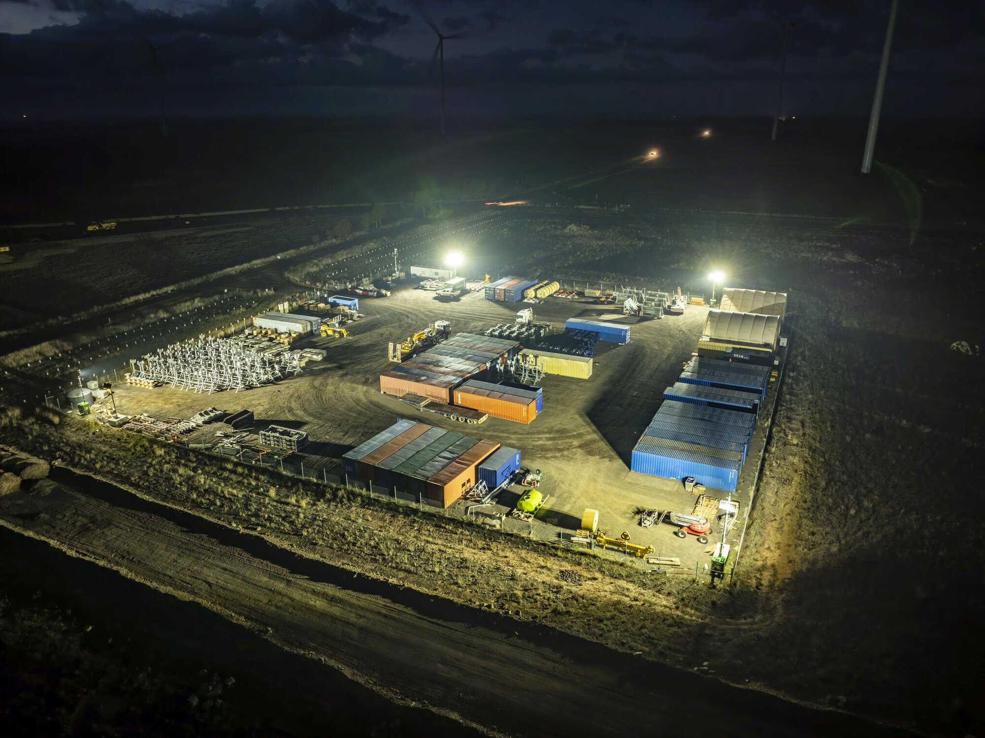 Hybrid light towers illuminating a wind farm construction site in Melbourne, Victoria.
