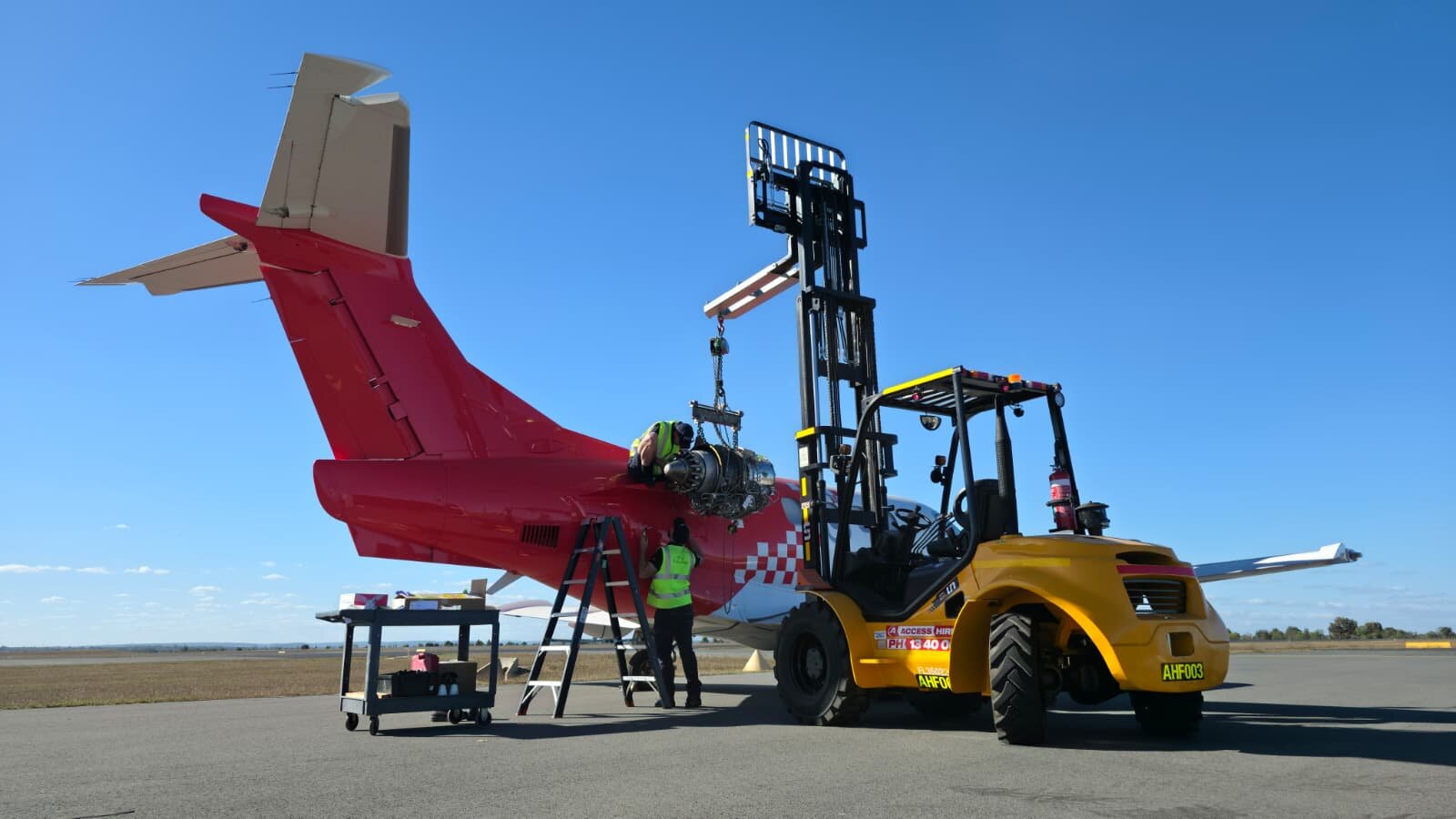 Access Hire forklift supporting aircraft engine maintenance at Moranbah Airport in Queensland