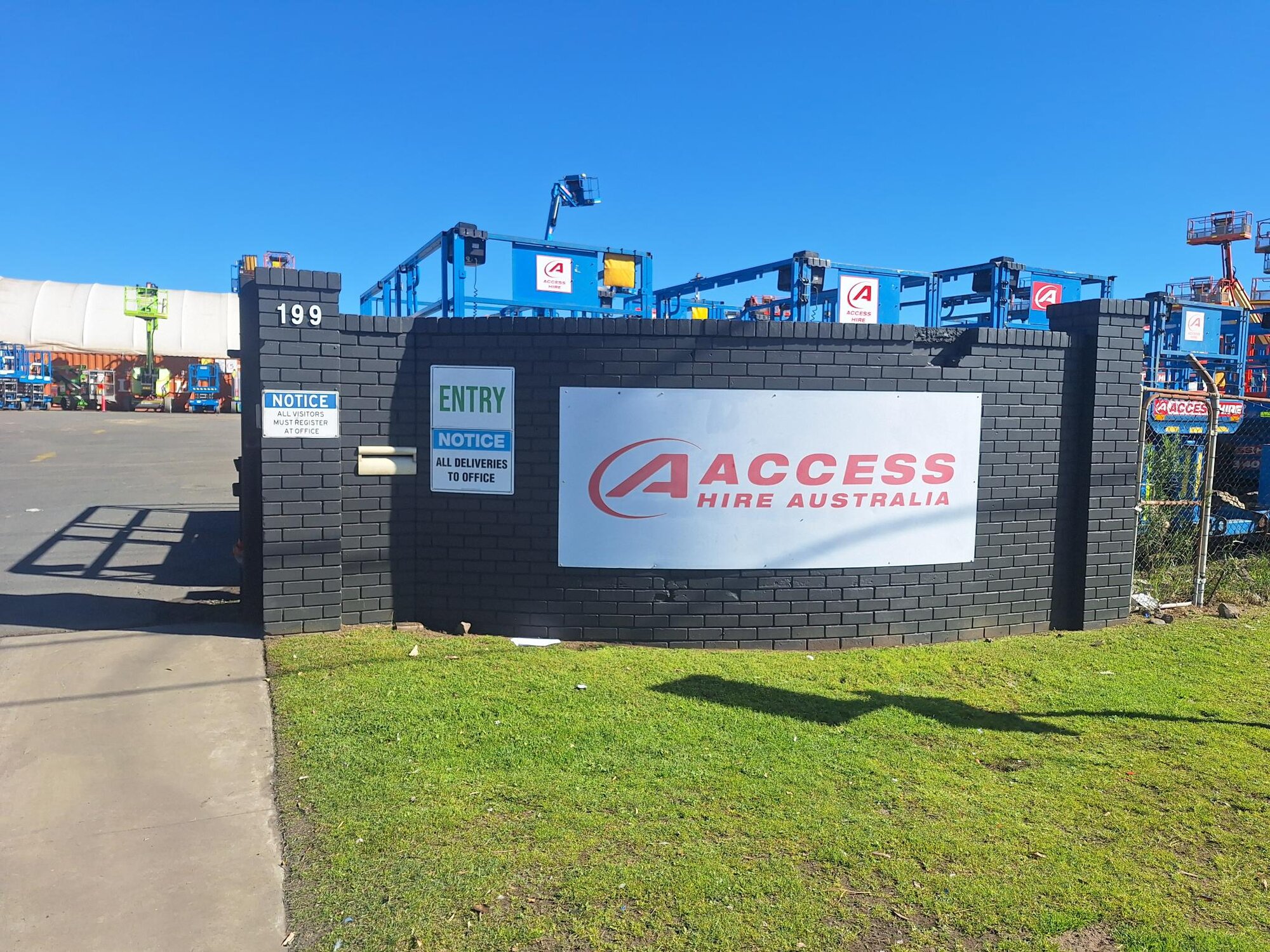 Boom lifts and scissor lifts displayed in the Access Hire Newcastle equipment yard