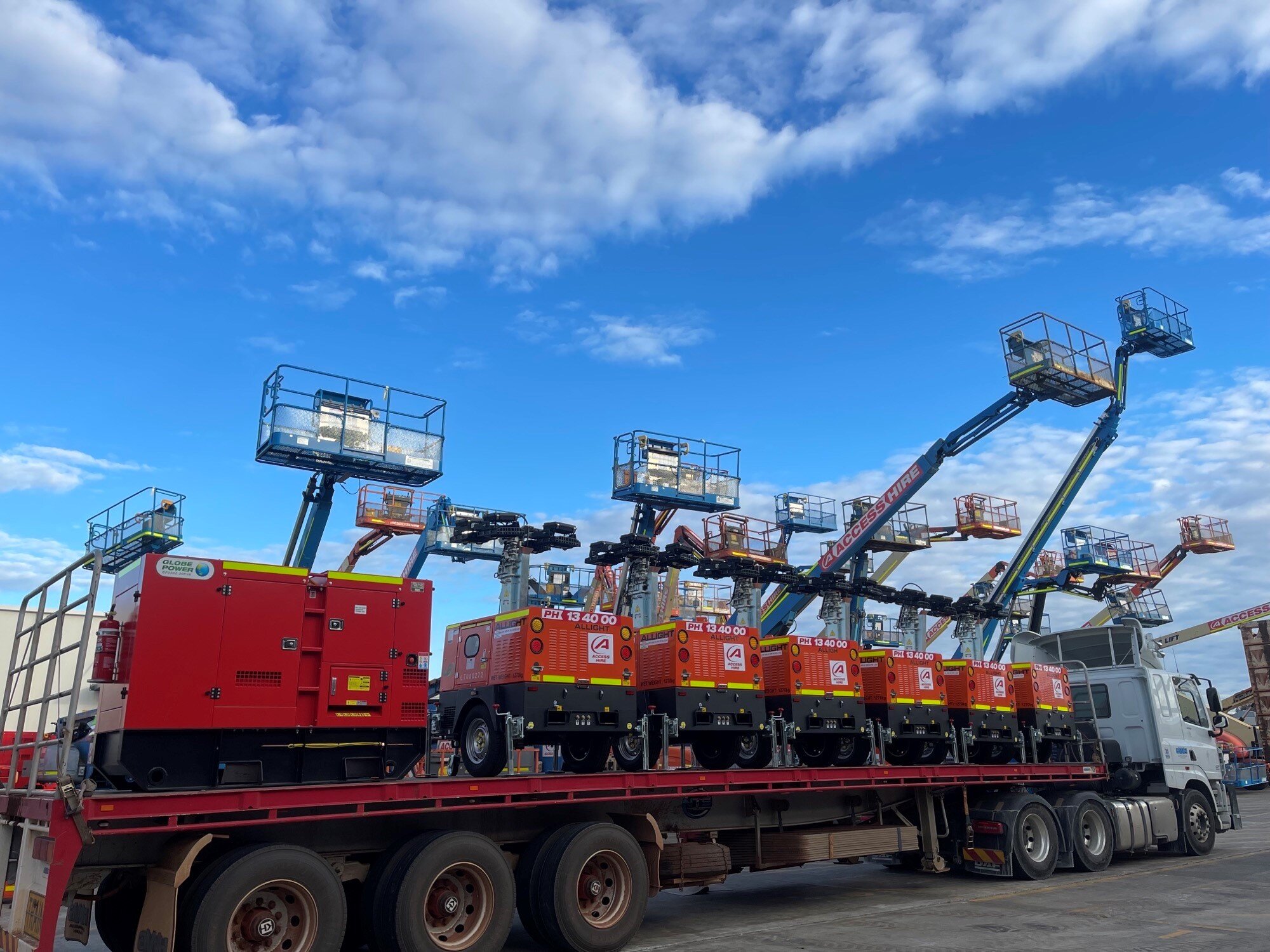 Access Hire equipment delivery featuring generators, lighting towers and elevated work platforms ready for deployment to site.