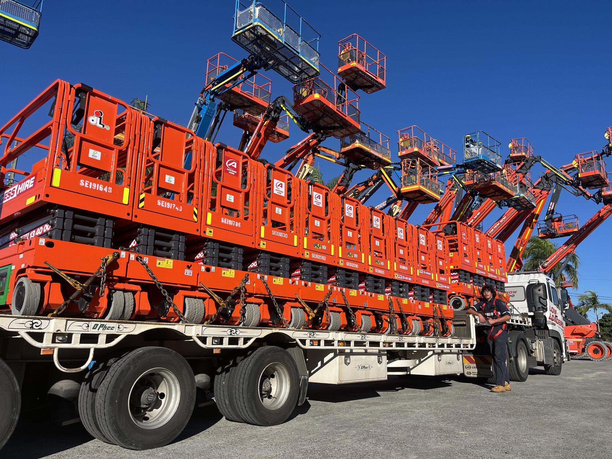 Dingli electric scissor lifts loaded onto a transport truck at the Access Hire Brisbane branch