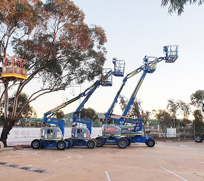 Boom lifts lined up in the Access Hire Kalgoorlie equipment yard